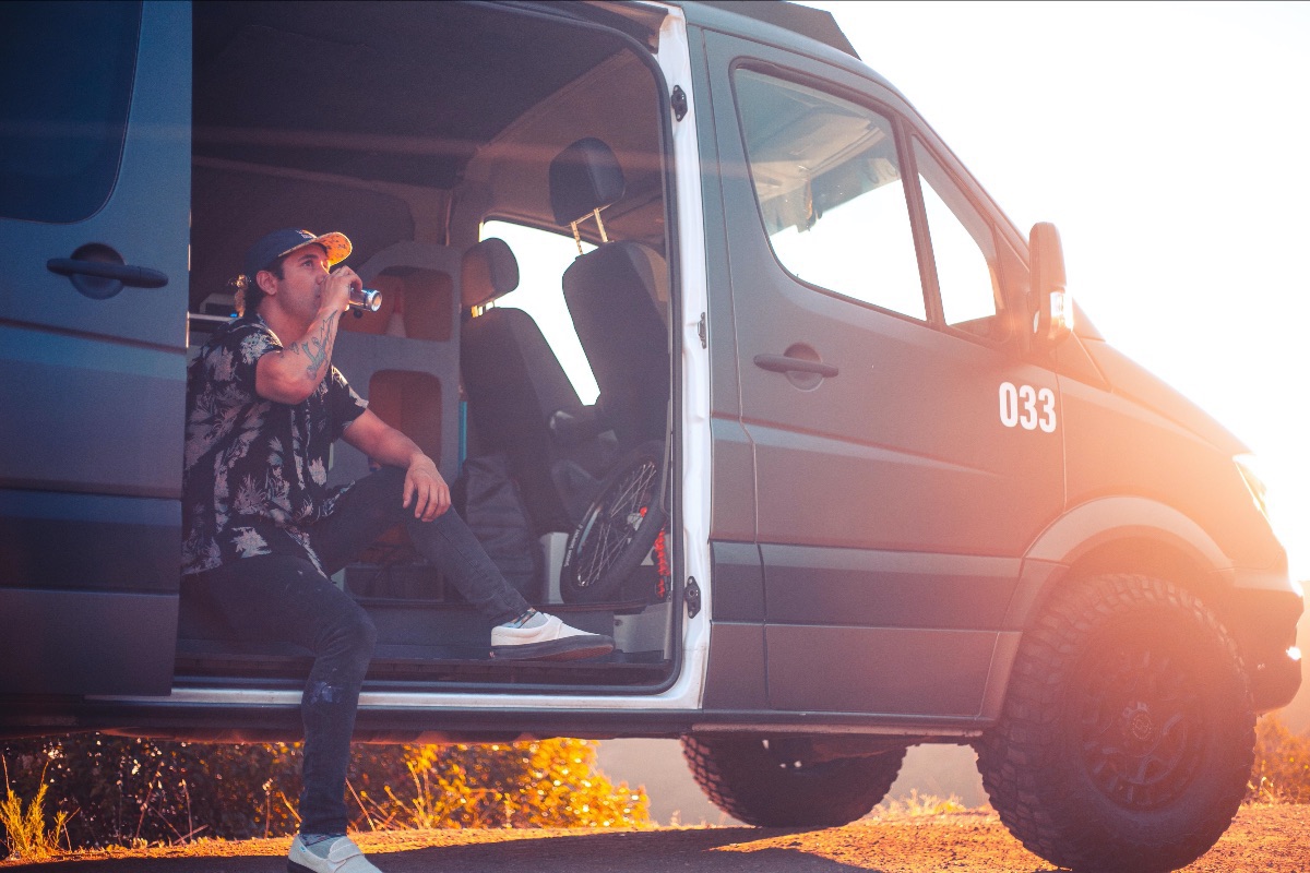 BMX X-Games athlete Coco Zurita sitting in sprinter van